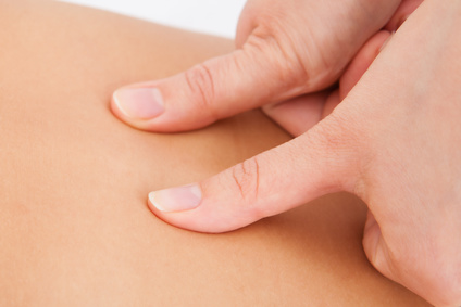 Closeup Of Person Receiving Shiatsu Treatment From Massager